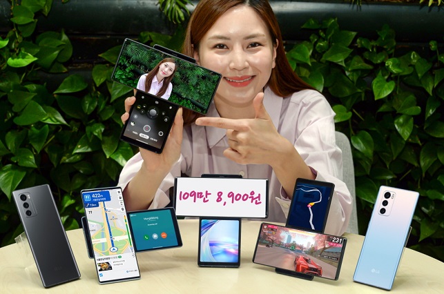 This photo, provided by LG Electronics Inc. on Sept. 22, 2020, shows a model promoting the Wing, LG's new dual-screen smartphone with rotating form factor. 