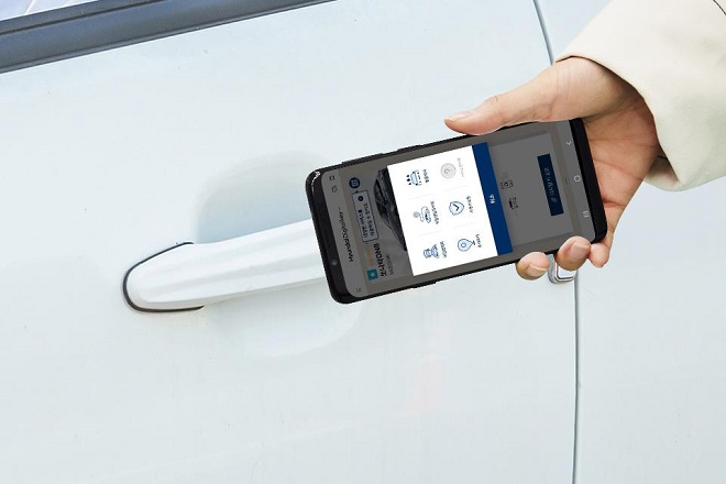 A digital key, which can lock and unlock a car using a downloaded app on a smartphone, is shown in this photo from Hyundai Motor and its sister firm, Kia Motors, on March 4, 2019. The automakers said they will add the digital key feature in phases in cars to be launched in the future to adapt to the car-sharing trend.