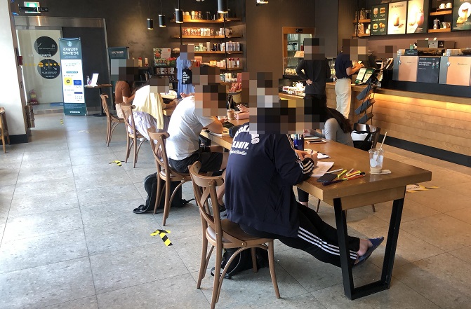 Patrons Fill Cafes, Gyms Again as Social Distancing Rules Eased in Greater Seoul