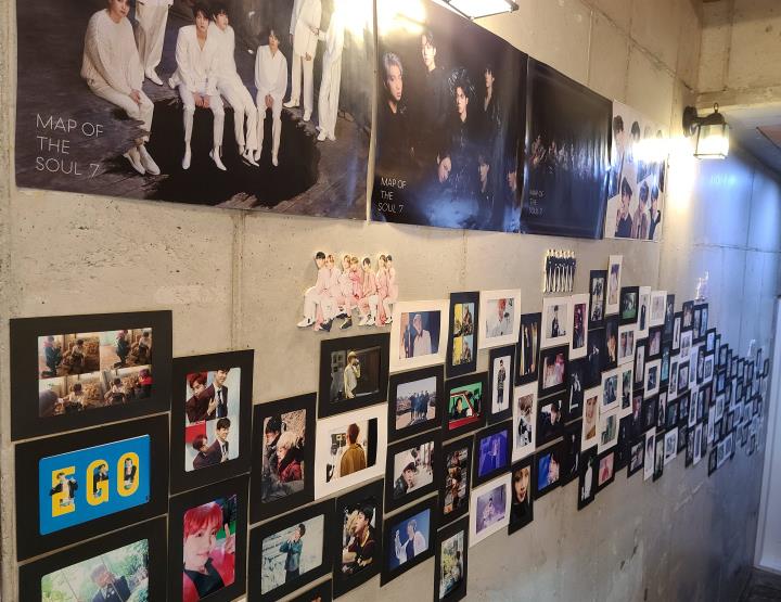 Frames and posters featuring K-pop super group BTS are hung inside a cafe in the southeastern city of Ulsan on Sept. 17, 2020. (Yonhap)
