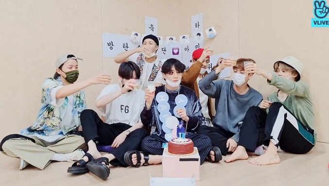 In this image captured from Naver's V Live site, members of K-pop band BTS hold an online meeting with fans on Sept. 1, 2020, in celebration of the group's ascent to the top of the Billboard Hot 100 singles charts in the United States the previous day.