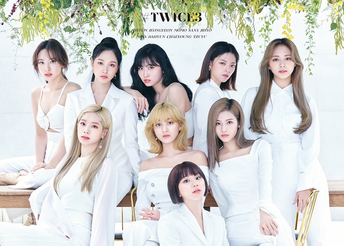 This image provided by JYP Entertainment shows the album cover art for K-pop girl group TWICE's new compilation album "#TWICE3" released in Japan. 