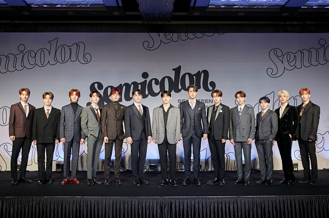 This photo provided by Pledis Entertainment on Oct. 19, 2020, shows members of K-pop group Seventeen posing for photos during an online showcase held at Coex Inter-Continental Hotel in southern Seoul. 