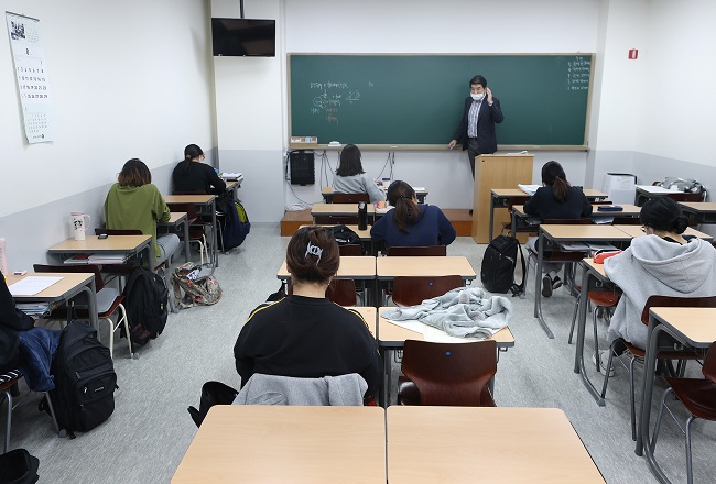 Watchdog Says Law Mandating Higher Education for Foreign Teachers Discriminatory