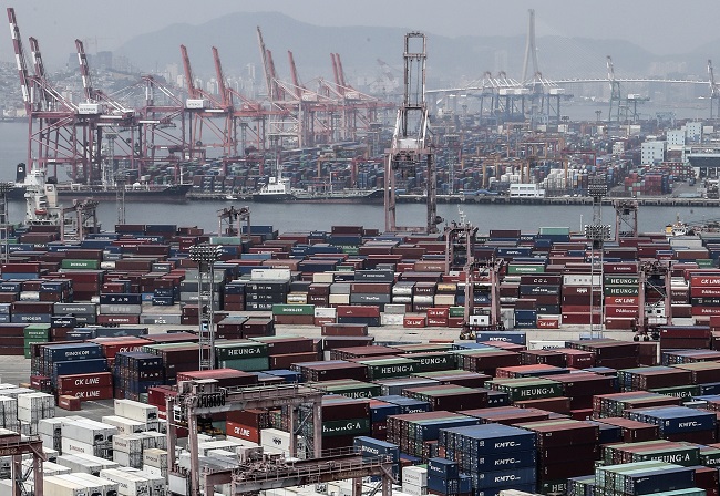 This file photo, taken June 4, 2020, shows stacks of import-export cargo containers at South Korea's largest seaport in Busan, 450 kilometers southeast of Seoul. (Yonhap)