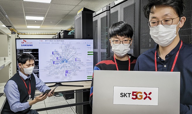 Researchers from SK Telecom Co. test its next-generation cloud native core network, which it co-developed with Samsung Electronics Co., at a laboratory in Seongnam, south of Seoul, on Nov. 22, 2020, in the photo provided by SK Telecom. 