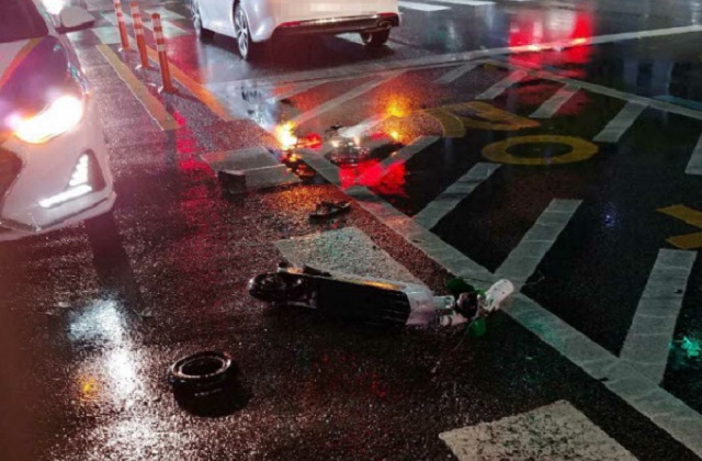 This photo, provided by the Busan Metropolitan Police Agency on April 12, 2020, shows an electric scooter destroyed after crashing into a sedan in the popular Haeundae district on the same day. The scooter rider sustained serious injuries and died later.