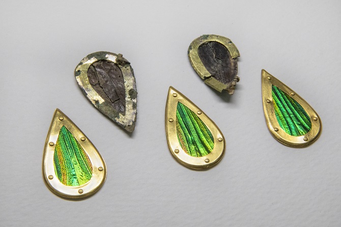 This photo, provided by the Gyeongju National Research Institute of Cultural Heritage on Dec. 7, 2020, shows jewel beetle ornaments that were found at Tomb No. 44 at Jjoksaem in Gyeongju, South Korea, and their replicas made for reference. 