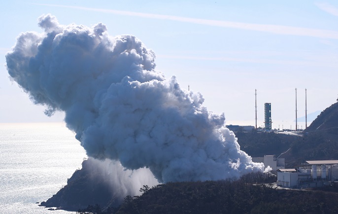In this file photo taken Jan. 15, 2020, rocket exhaust and steam rises into the air over the Naro Space Center on Oenaro Island, 485 kilometers south of Seoul, during a test conducted on a 75-ton thrust engine. (Yonhap)