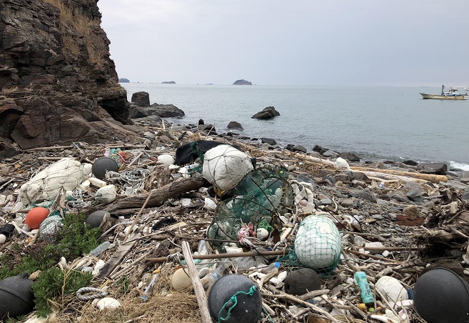 This photo, provided by Green Korea United, shows debris and trash on Guji islet near Yeonpyeong Island. 