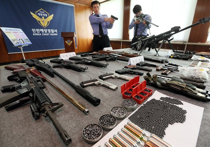 This undated file photo shows firearms caught by the Korea Coast Guard in smuggling attempts. (Yonhap)