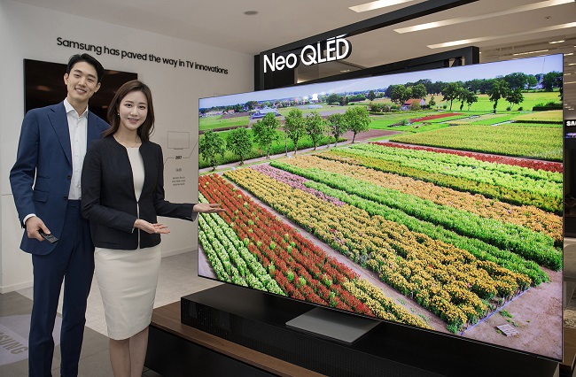 Models show off Samsung Electronics' Co.'s new product Neo QLED TV during a publicity event at Samsung Digital City in Suwon, in this photo released by Samsung on Jan. 7, 2021.