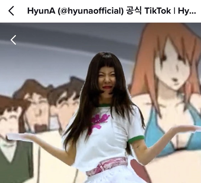 This screenshot, taken from HyunA's official TikTok account, shows the singer dancing to her new song "I'm Not Cool" against an image of a "Crayon Shin-chan" episode.
