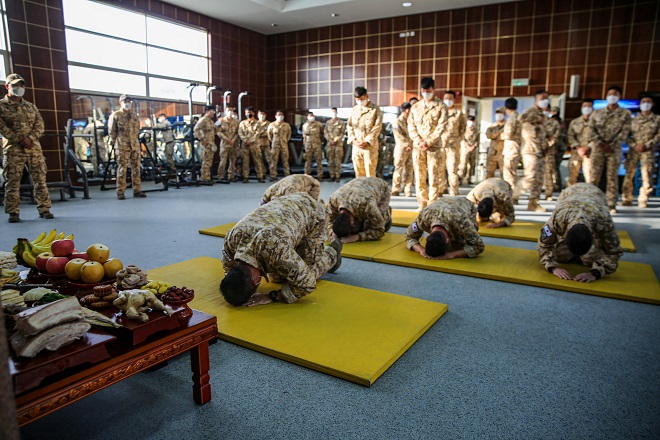 South Korean service members affiliated with the Akh Unit in the United Arab Emirates hold a memorial service for ancestors ahead of the Lunar New Year that falls on Feb. 12, 2021, in this photo provided by the Joint Chiefs of Staff (JCS) on the day.