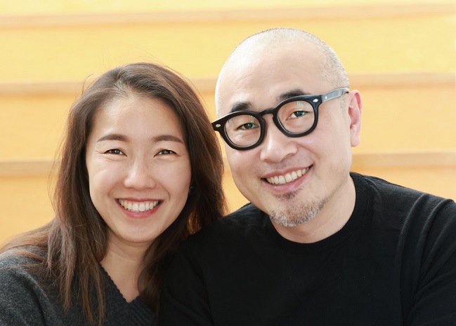 This image, provided by Woowa Brothers Corp. on Feb. 18, 2021, shows CEO Kim Bong-jin (R) and his wife Sul Bomi. 