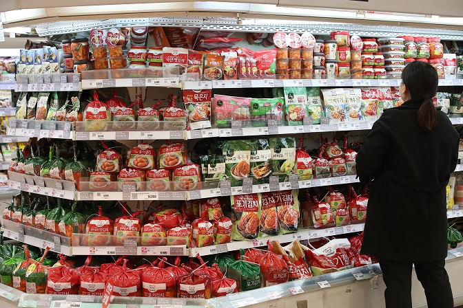 In the Feb. 15, 2021, file photo, a woman shops for groceries at a supermarket in Seoul. (Yonhap)