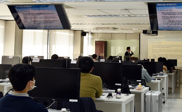 This photo provided by NIS shows students taking a cyber security class at the National Security Research Institute in Daejeon.