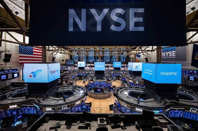 An electronic signboard on the floor of the New York Stock Exchange shows the logo of South Korean e-commerce giant Coupang Inc., which debuted on the U.S. bourse on March 11, 2021, in this photo released by Coupang. 