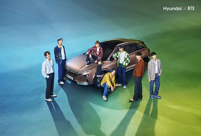K-pop boy band BTS poses for a photo with Hyundai Motor Co.'s fuel cell electric vehicle NEXO in this photo provided by the Korean automaker on April 21, 2021.