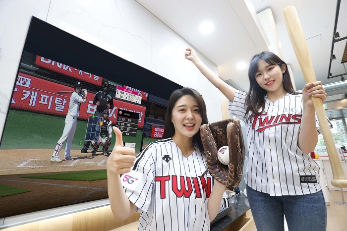 This undated photo provided by LG Uplus Corp. shows models promoting the company’s service platform for the pro baseball league in South Korea.