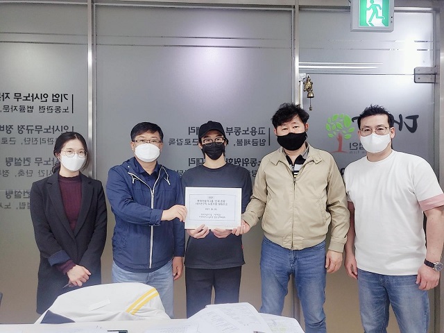 This photo, taken April 25, 2021, and provided by Daesang Labor Law Firm, shows representatives of office workers at Hyundai Motor Group after attending a meeting to set up their own union at the law firm in Seoul.