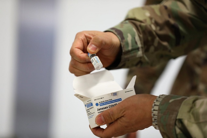 This photo, captured on March 10, 2021, from the U.S. Forces Korea's Facebook account, shows a staffer checking a vaccine vial.