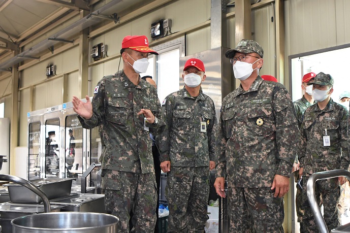 High-ranking officers of the South Korean Navy visit a restaurant for recruits to inspect the Navy's measures against the new coronavirus on May 3, 2021, in this photo provided by the Navy.