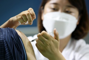 People Given First Dose of Coronavirus Vaccine Can Go Maskless Outdoors Starting in July