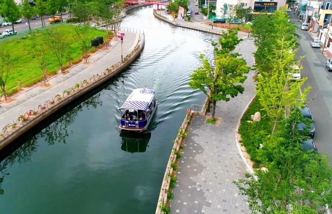 This photo provided by Hyundai Heavy Industries Group on June 16, 2021, shows a 12-person fully autonomous cruise ship navigating autonomously through the narrow 10-kilometer Pohang Canal in the port city, 302 kilometers southeast of Seoul, with crew members on board.