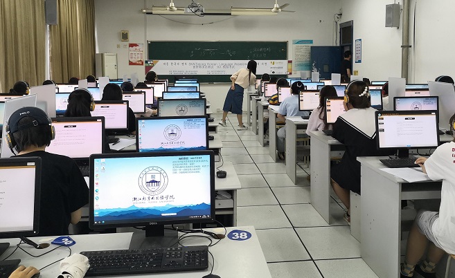 This photo, provided by the state-run King Sejong Institute Foundation, shows students taking a pilot version of the Sejong Korean Language Assessment test, which will be launched in 2022, at an education center in Hangzhou, China.