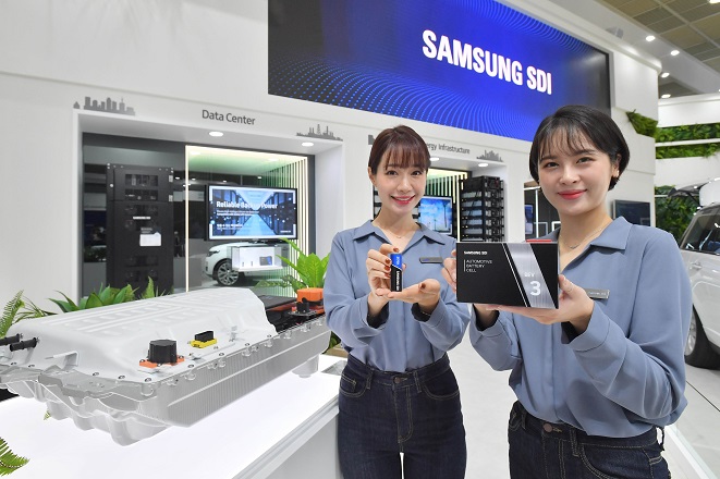 Models introduce Samsung SDI Co.'s battery products at a booth for InterBattery 2021, which runs from June 9-12 2021, at the Convention & Exhibition Center in southern Seoul, in this photo provided by the company on June 8, 2021.
