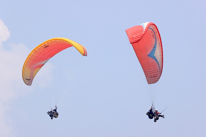 Disabled Persons with Spinal Cord Injuries Participate in Paragliding Event