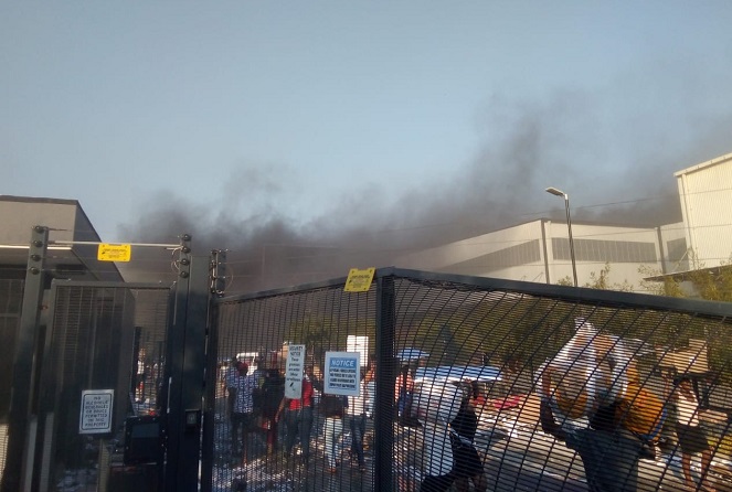This photo provided by a South Korean resident in South Africa shows LG Electronics Inc.'s factory in Durban on fire on July 12, 2021. (Yonhap)