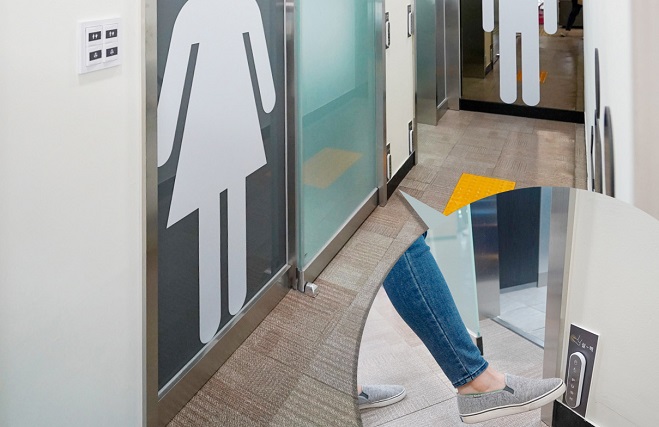 This photo provided by the Seoul Metropolitan Government shows a new public restroom with a foot switch.