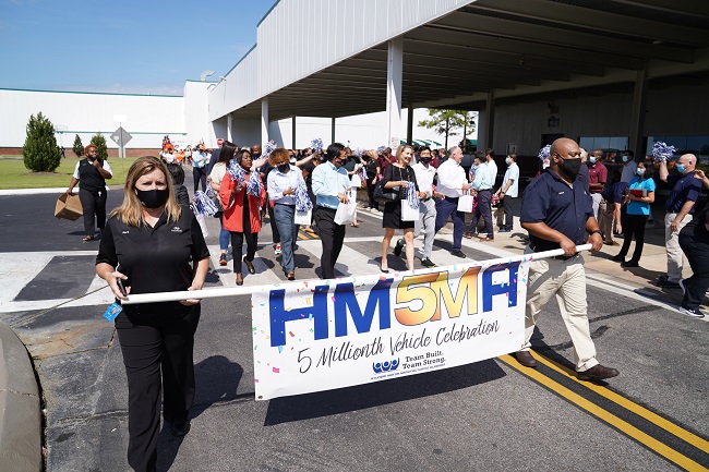 This photo taken and provided by Hyundai Motor on Aug. 12, 2021, shows local employees of the carmaker's Alabama plant marching to celebrate the production of the 5 millionth vehicle in the factory.