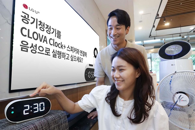 Models introduce LG Uplus Corp.'s CLOVA Clock+2 on Aug. 24, 2021, in this photo provided by the  South Korean telecom operator.