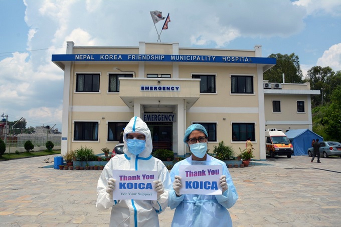 Nepalese healthcare workers pose for oxygen concentrators the South Korean government donated to the country in this photo provided by overseas aid institution KOICA.