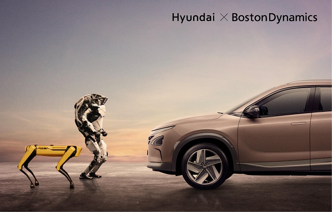 Spot (L), a four-legged robot, and Atlas, a humanoid bipedal robot (C), designed by Boston Dynamics, and Hyundai Motor Co.'s fuel cell electric vehicle (R) are seen in this photo provided by the Korean automaker and two other affiliates, which officially acquired the U.S. startup on June 21, 2021.
