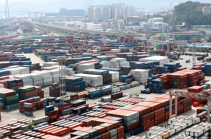 This file photo, taken Aug. 2, 2021, shows stacks of containers at a port in South Korea's southeastern city of Busan. (Yonhap)
