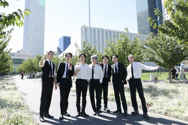 This photo, provided by Big Hit Music on Sept. 21, 2021, shows K-pop sensations BTS posing in front of the U.N. headquarters. BTS addressed the U.N. General Assembly on Sept. 20, and played a video of the septet performing "Permission to Dance," in and outside the U.N. headquarters.