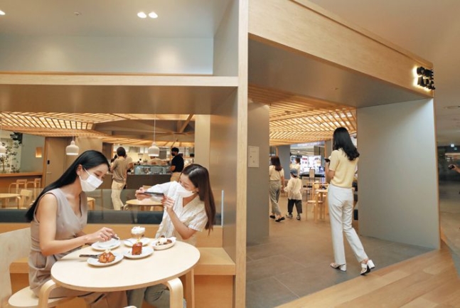 This photo provided by A.P.C. shows its in-store café in the Dongtan outlet of Lotte Department Store in Hwaseong, south of Seoul.
