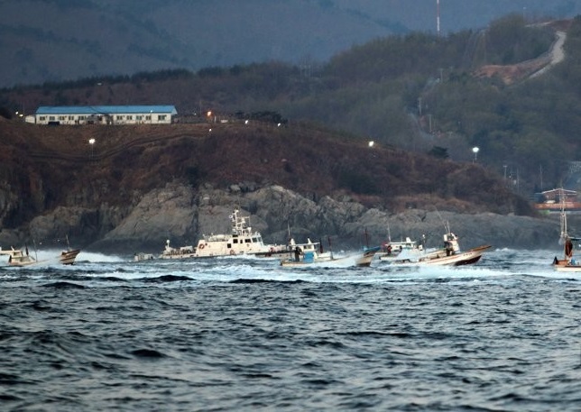 Fishing boats enter waters off Jeo Island in the Goseong region of South Korea's east coast on April 9, 2020, in this photo released by the Coast Guard. 