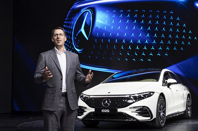 This photo taken on November 25, 2021 and provided by Mercedes-Benz Korea shows German automaker President and CEO Thomas Klein briefing on the company's plans for electric vehicles in South Korea during Seoul Mobility Show, which lasts until December 5.  KINTEX showroom in Goyang, north of Seoul.