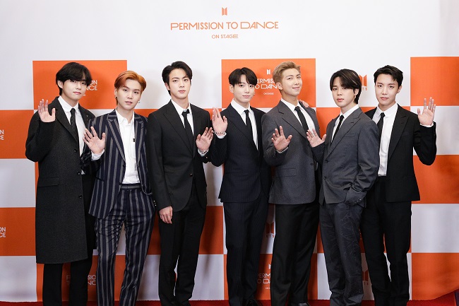 Members of the K-pop phenom BTS pose for the camera during a press conference at SoFi Stadium in Los Angeles on Nov. 29, 2021, in this photo provided by its agency Big Hit Music.