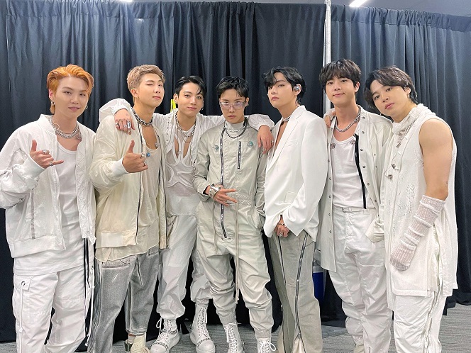 Members of the K-pop phenom BTS pose for photos backstage at SoFi Stadium in Los Angeles on Nov. 27, 2021 (local time), in this image captured from BTS' official Twitter page. The chart-topping group had its first in-person concert in two years in the American city, in front of some 50,000 fans.