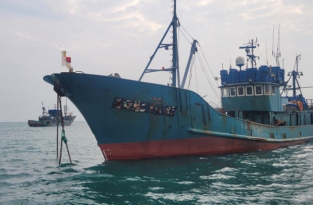 This photo, provided by the South Korean Coast Guard on Dec. 25, 2021, shows the Chinese fishing boat seized this week for allegedly writing false information in ship logs.