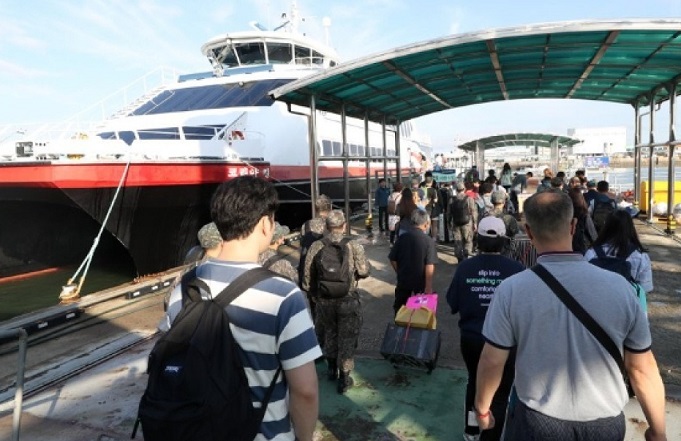 This undated file photo shows people walking to board a passenger ship at Incheon Port, west of Seoul. (Yonhap)