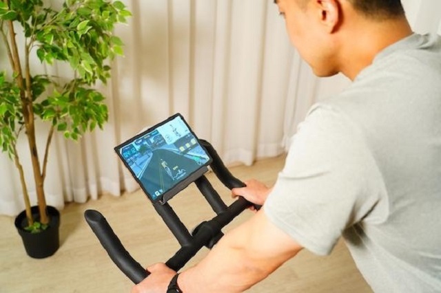 This photo provided by Yanadoo shows its home training service platform Yafit Cycle.