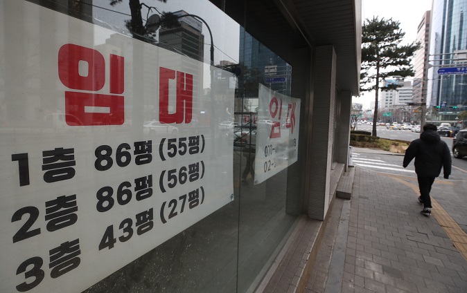 This photo, taken Jan. 5, 2022, shows a for lease sign put up at a store in the shopping district of Myeongdong. (Yonhap)
