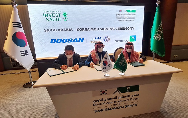 This photo, provided by Doosan Heavy Industries & Construction on Jan. 19, 2022, shows a signing ceremony on the construction of a casting and forging factory in Saudi Arabia.